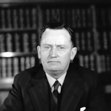 Frank Forde at his desk. 